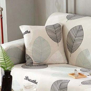 Stretch-Kissenbezüge 45 × 45 cm — 2er-Set, Ecru mit grauem Laub, auf einem Sofa